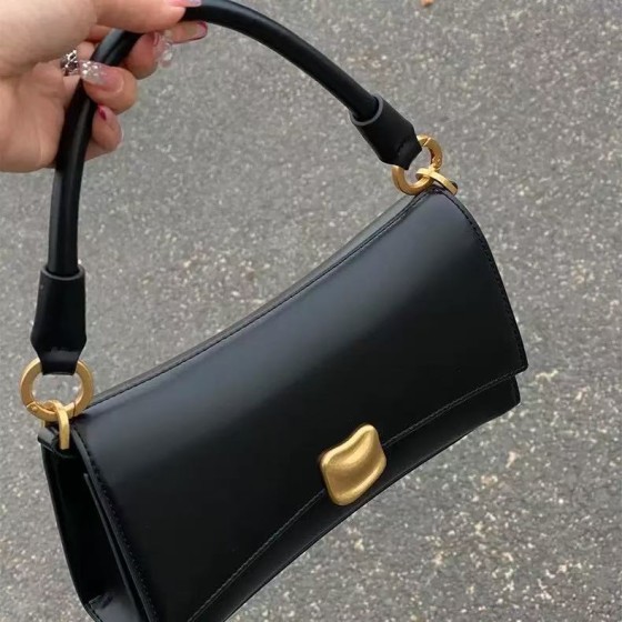 Black baguette bag with underarm design, high-quality niche handbag, trendy crossbody bag.
